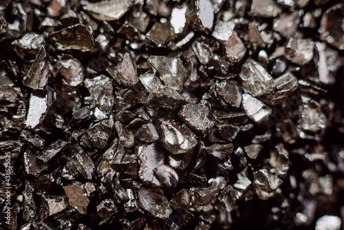 Modern industry depends on mining for the valuable rare-earth, rare earth crystal detail photo