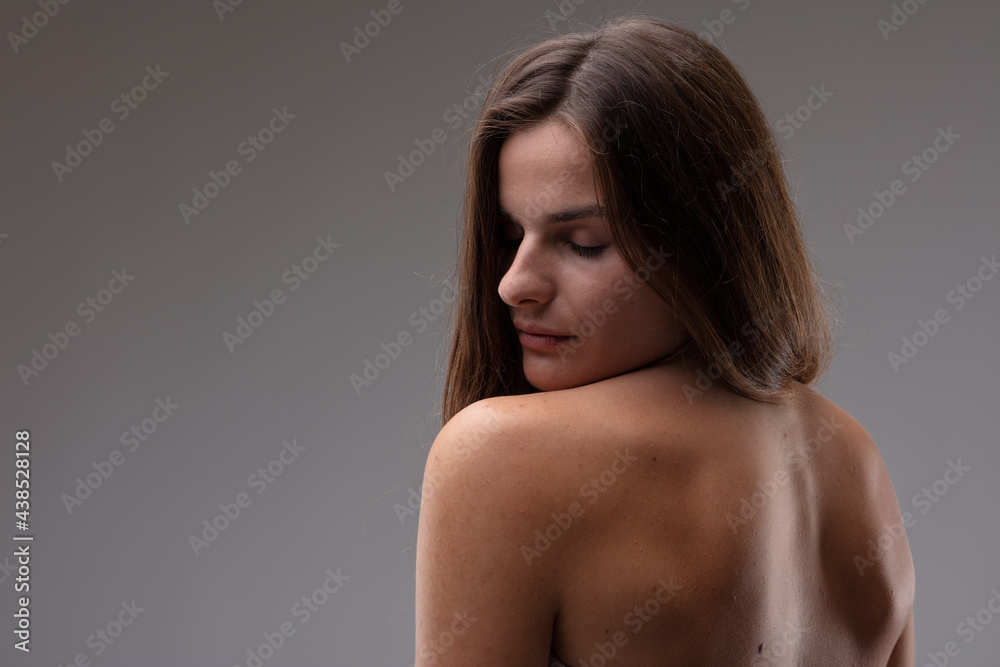 Seductive sensual young woman looking back over her shoulder Seductive sensual young woman looking back over her shoulder