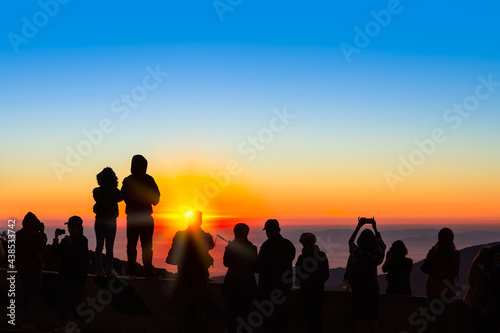 Silhouetted of people with sunrise in northern thailand
