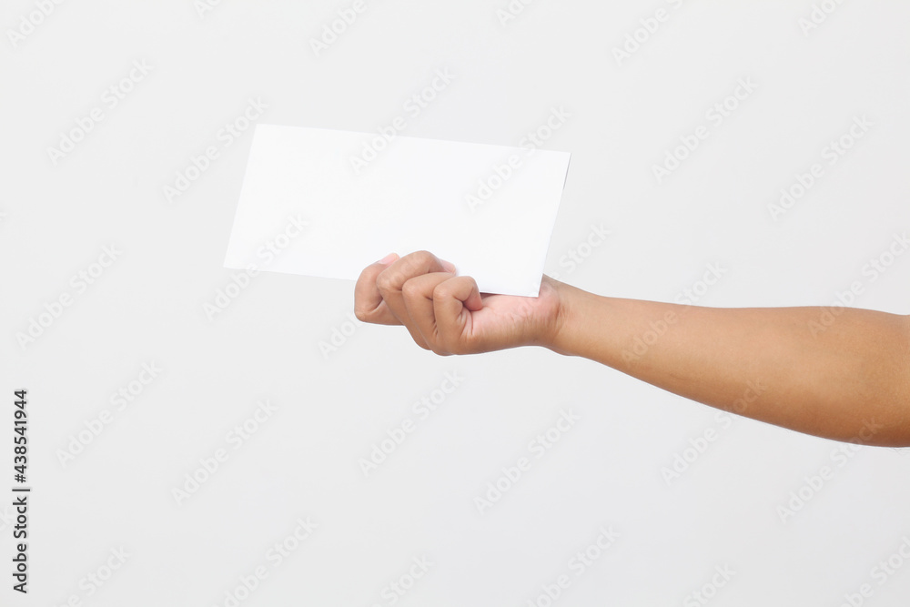 Man's hand holding envelope isolated on white background. Close up Man's hand holding envelope isolated on white background. Close up