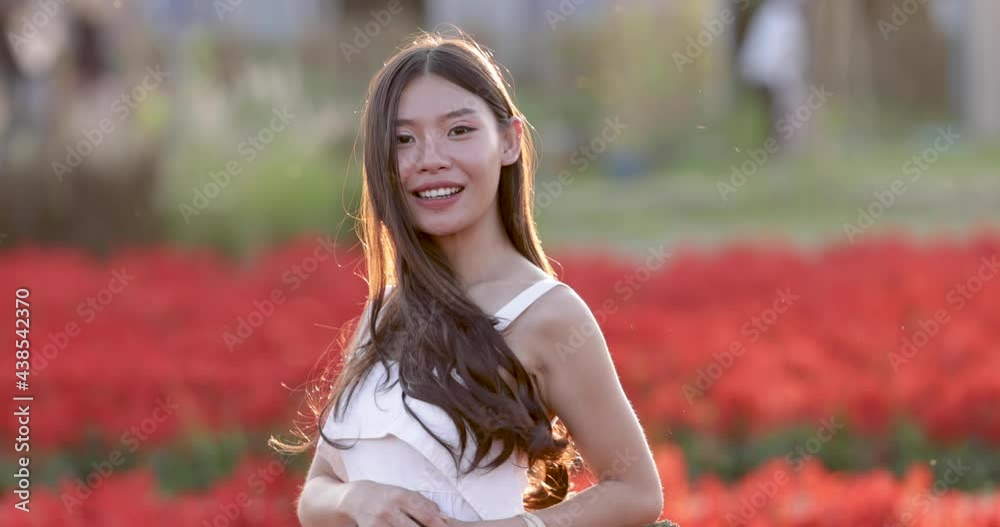 young asian girl in white wedding dress relaxing in the flowers garden 4k video slow motion young asian girl in white wedding dress relaxing in the flowers garden 4k video slow motion