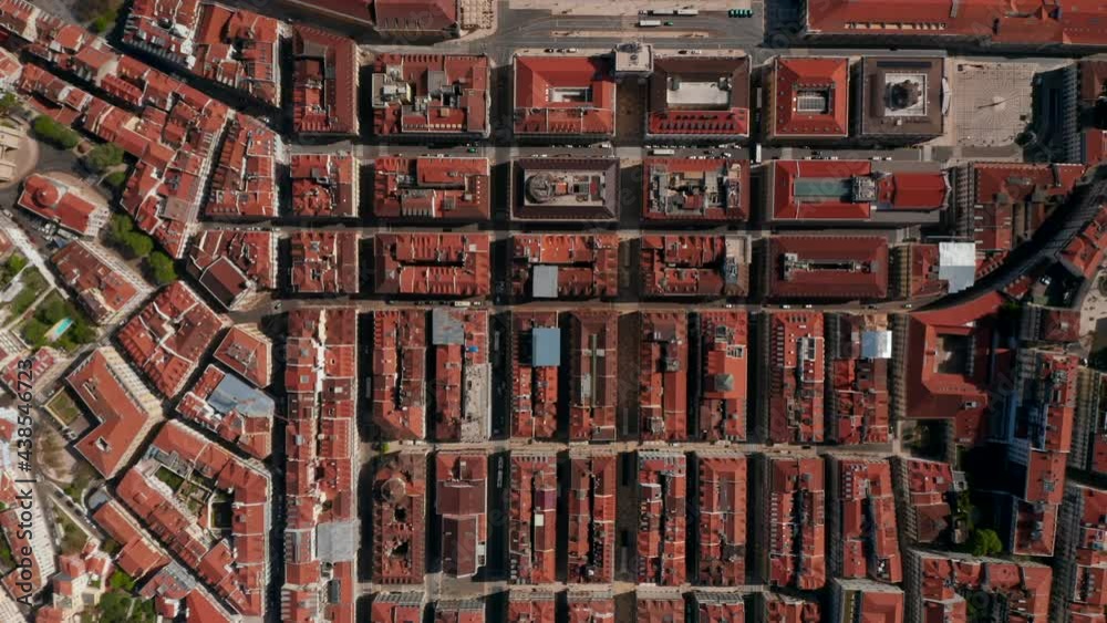 Aerial birds eye overhead top down panning view of streets and buildings in town. Symmetrical deployment of house blocks from above. Lisbon, capital of Portugal. Aerial birds eye overhead top down panning view of streets and buildings in town. Symmetrical deployment of house blocks from above. Lisbon, capital of Portugal.