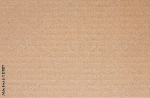 Cardboard sheet texture background, detail of recycle brown paper box pattern.