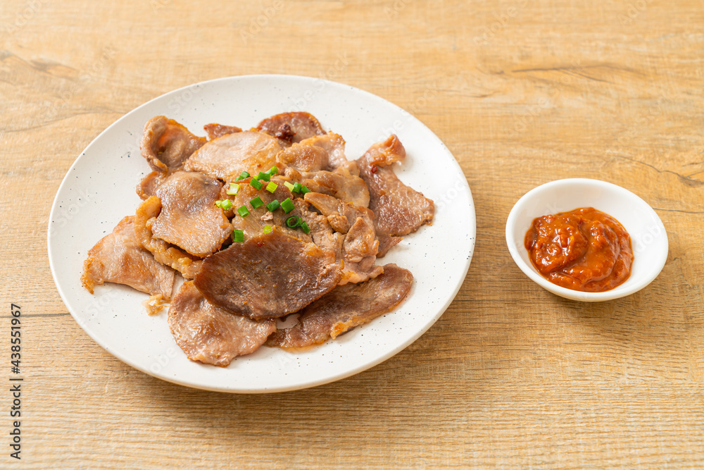 grilled pork neck sliced on plate