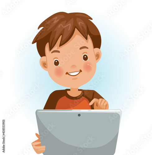 Boy using tablet. Looking , touching the screen with a pleasant surprise. Sitting on a chair in home. Happy child using online Internet with tablet. Enjoy with learning technology.