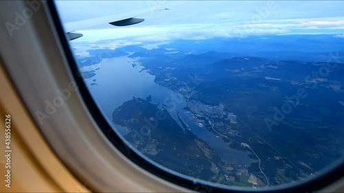 View from airplane window on fields in wing with top view of Vancouver, Canada photo