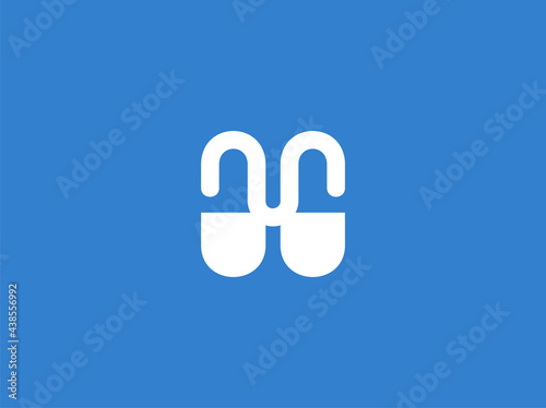 Letter M pill capsules logo design element