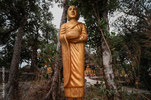 Golden statue on the grounds of Wat Sampov Pram atop Phnom Bokor (Preah Monivong National Park) on Kampot, Cambodia