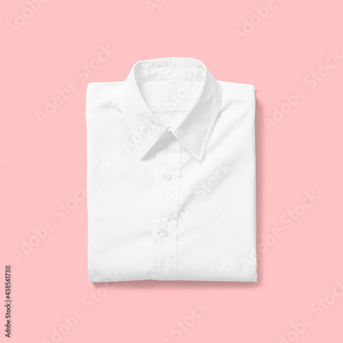 Top up up view white shirt folded isolated on pink background. suitable for your design project.