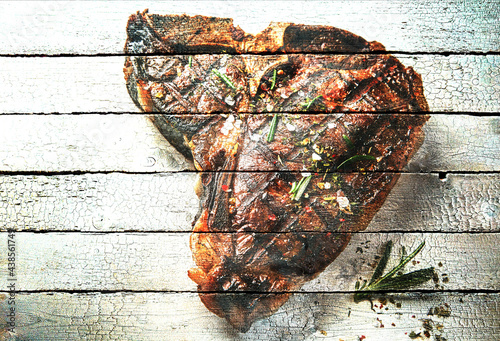 Picture of grilled steak on wooden table