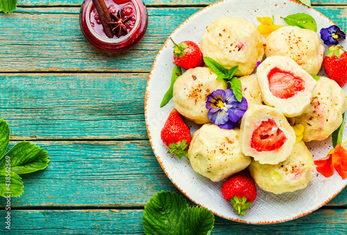 Sweet dumplings with strawberries or knedlik photo