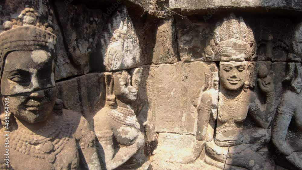 Stone carvings of Buddhas in the passages of the Terrace of the Elephants in Siem Reap, Cambodia Stone carvings of Buddhas in the passages of the Terrace of the Elephants in Siem Reap, Cambodia