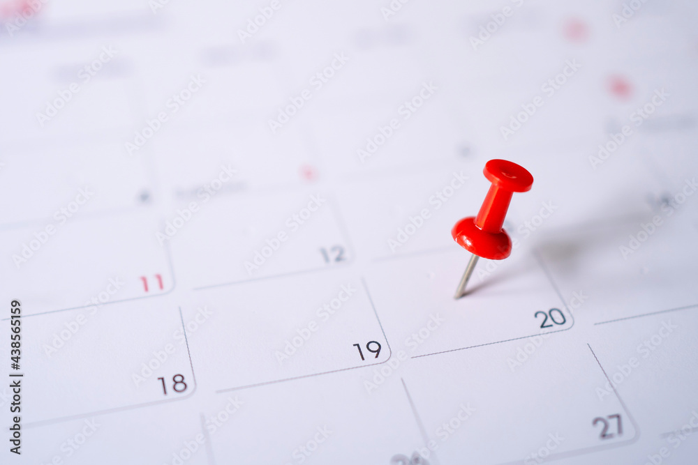 Calendar with red pins on the 20th, mark the date of the event with a pin. Calendar with red pins on the 20th, mark the date of the event with a pin.