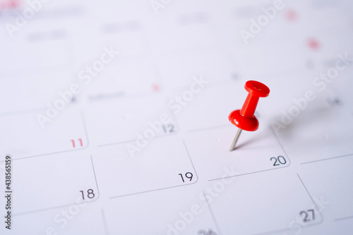 Calendar with red pins on the 20th, mark the date of the event with a pin.