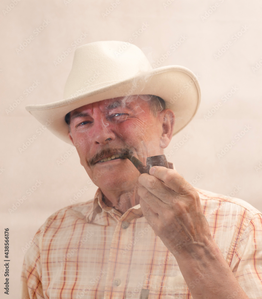 Cowboy in white hat with Pipe