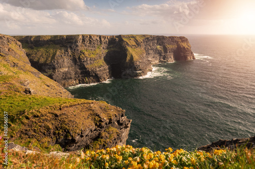 Amazing view on Cliff of Moher  county Clare  Ireland. Popular landmark with unparalleled scenery. Warm sunny day  Cloudy sky