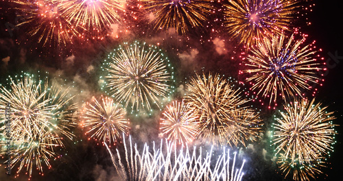 Colorful vibrant Firework celebrate anniversary happy new year 2022, 4th of july holiday festival. colorful firework in the night time to celebrate national holiday. countdown new year 2022 party time © aFotostock