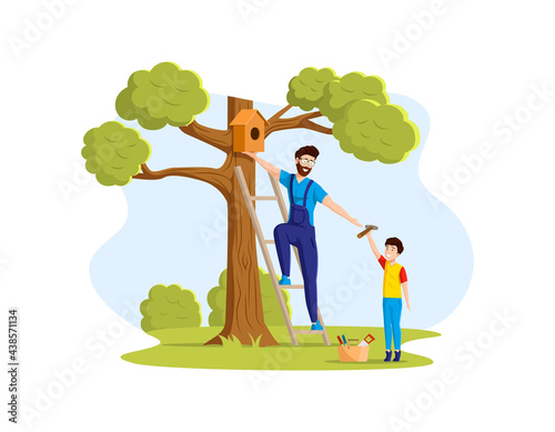 Happy father and son hanging birdhouse on tree. Smiling family dad boy enjoying summer outdoor activity. Weekend sparetime and outdoors activity, friendly family