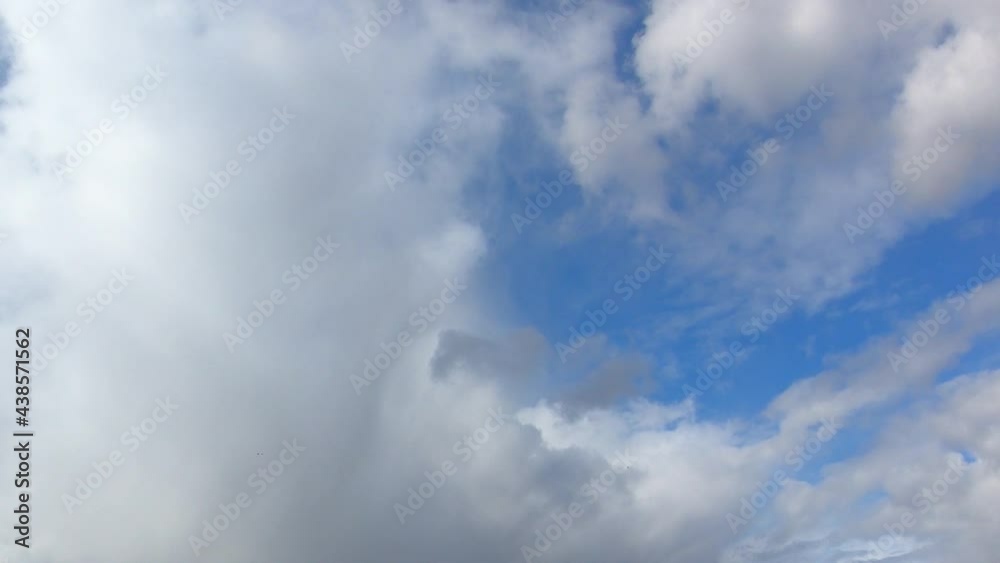 Dense cumulus clouds against the clear blue sky. Nice weather, time-lapse.
Dense cumulus clouds against the clear blue sky. Nice weather, time-lapse.