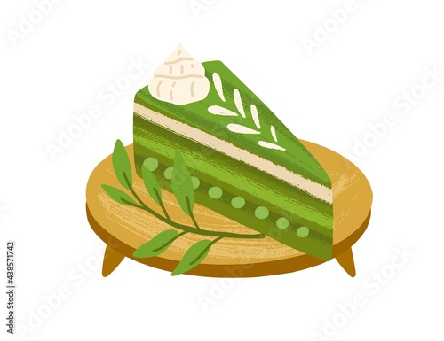 Piece of matcha cake with green tea flavor, served on wooden board with leave...