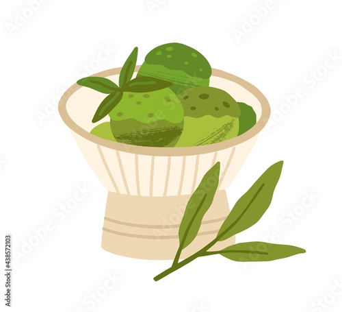 Japanese matcha green tea ice cream served in bowl with leaves. Organic natur...