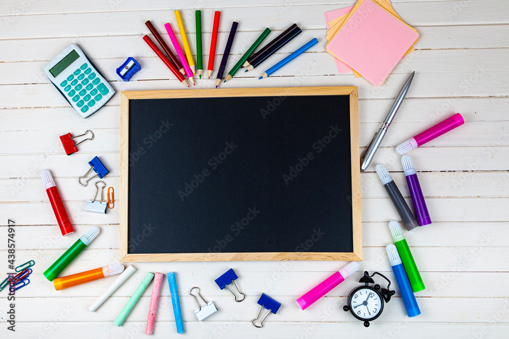 Various school supplies on a wooden table. Various school supplies on a wooden table.