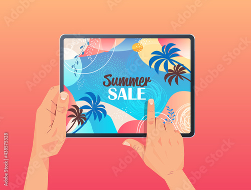 human hands using tablet pc with summer sale banner flyer or greeting card on screen horizontal
