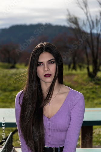 portrait of young woman in a wool sweater outdoors