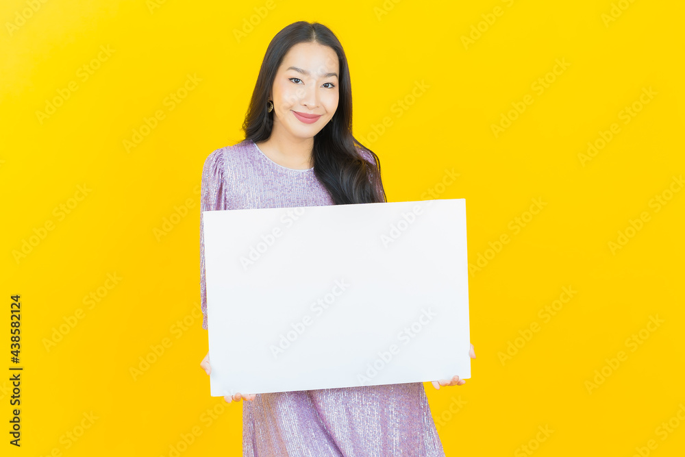 Portrait beautiful young asian woman with empty white billboard Portrait beautiful young asian woman with empty white billboard
