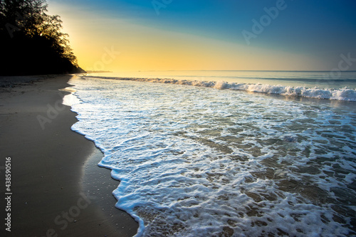 evening sandy beach golden sunlight