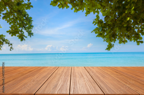 empty new wood table and tropical blue sea in background