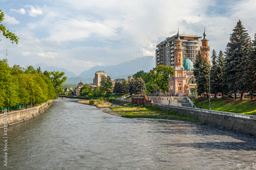 The Terek river and a mosque in the background of Table Mountain. Vladikavkaz, North Ossetia, Russia
