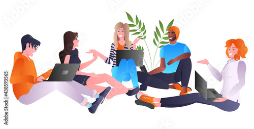 mix race friends using laptops and discussing during meeting communication concept