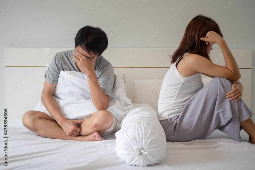 Asian couples are disappointed and sad after an argument. Family problems leading to divorce, love problems Asian couples are disappointed and sad after an argument. Family problems leading to divorce, love problems