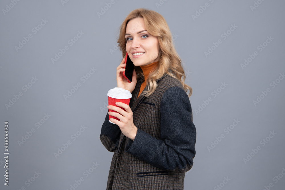 Enhanced coffee for enhanced lifestyle. Woman hold disposable cup talking on phone. Modern lifestyle Enhanced coffee for enhanced lifestyle. Woman hold disposable cup talking on phone. Modern lifestyle