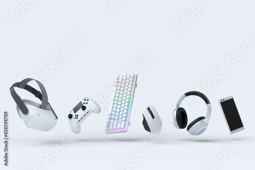 Fotografie Flying gamer gears like mouse, keyboard, joystick, headset, VR on white