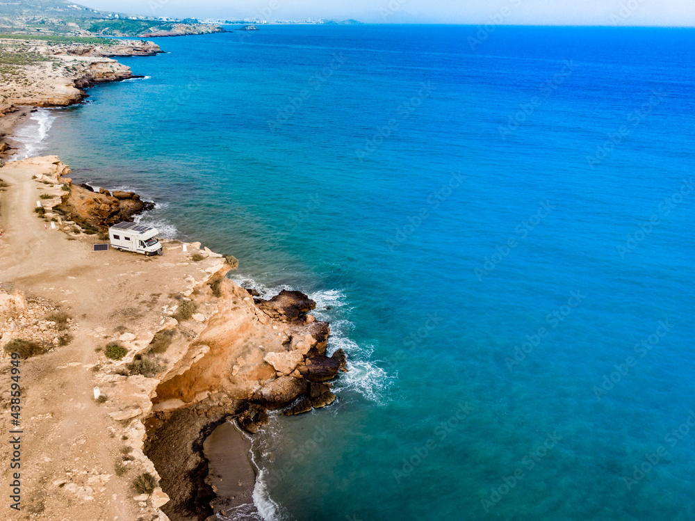 Camper on coast in Spain. Aerial view