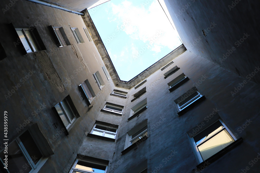 Fototapeta premium Bottom up view of a tall house. Modern architecture.