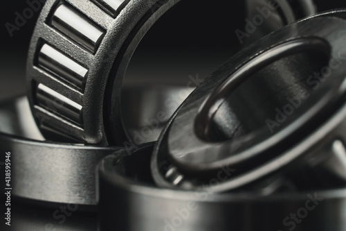 Two new car bearings on a black background macro photo photo