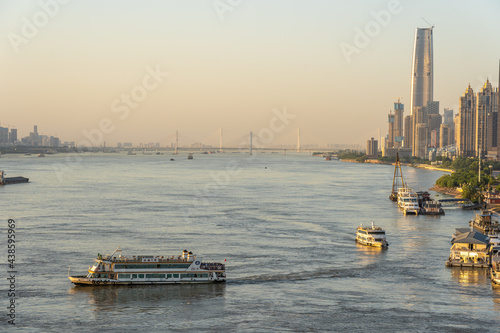 Wuhan skyline and Yangtze river with supertall skyscraper under construction in Wuhan Hubei China.