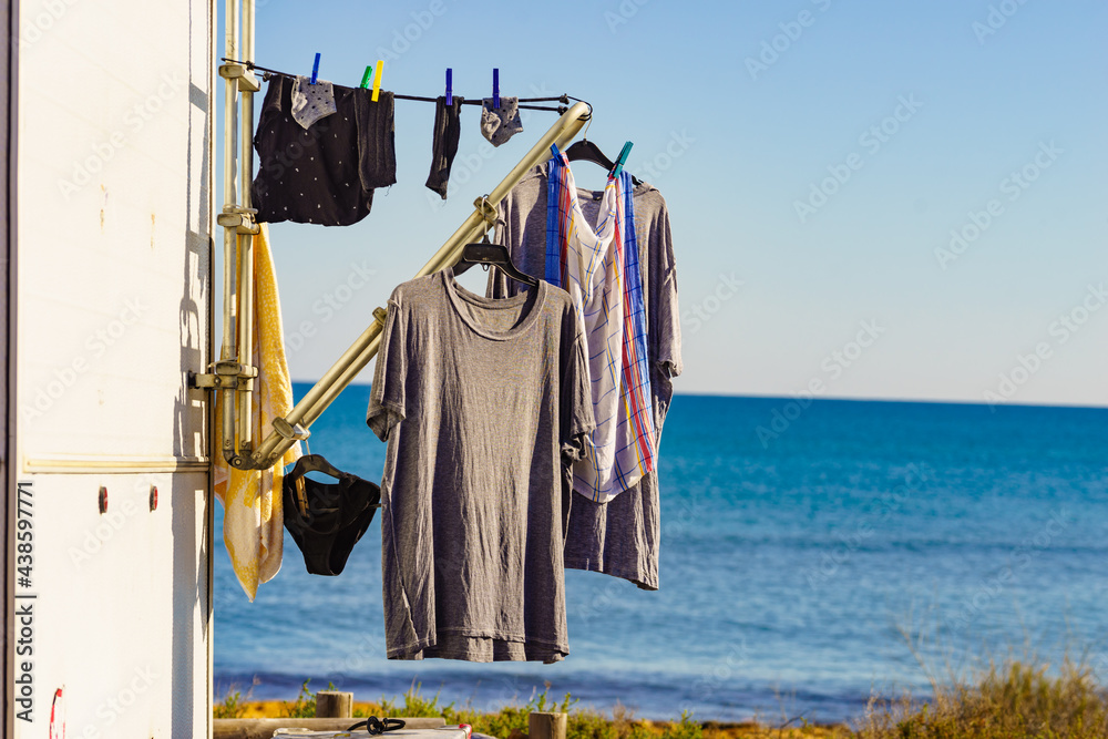 Caravan on beach with clothes to dry