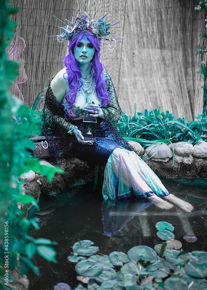 dark mermaid siren in the pond