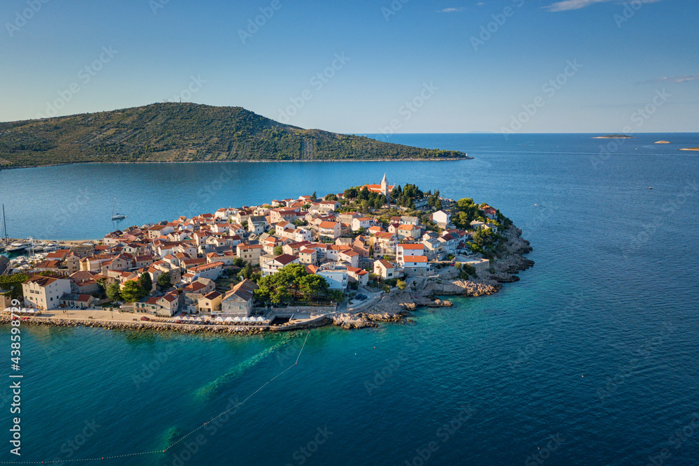 Amazing seascape, scenic aerial view of Primosten old town on the islet, Dalmatia, Croatia. Popular tourist destination and summer resort on Adriatic seacoast, outdoor travel background