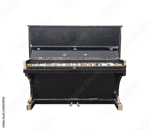 Old upright piano isolated on white background. Stringed musical instrument
