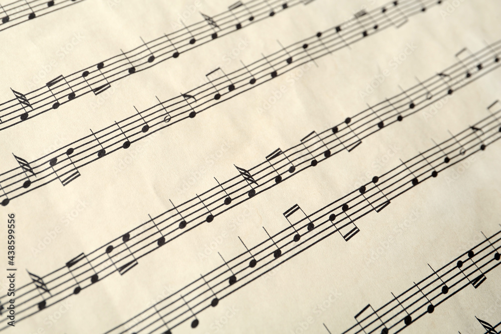 Paper sheet with musical notes, closeup view Paper sheet with musical notes, closeup view