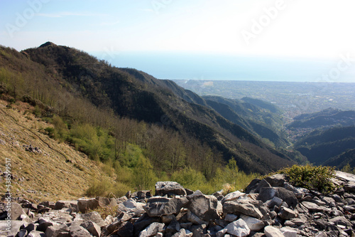 fantastic landscape valley of Monte Pasquilio and the Apuan Alps on the summit in summer © Alessia