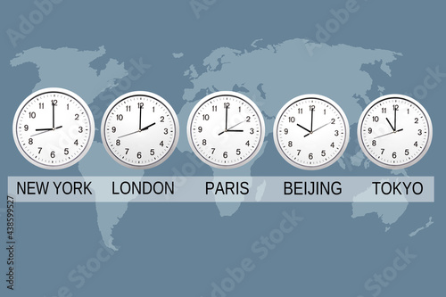 world map and wall clocks with hour in important cities photo