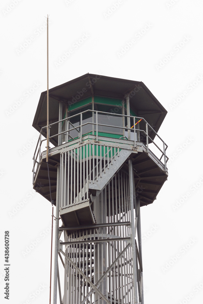 Fire watchtower with guard in the cabin Fire watchtower with guard in the cabin