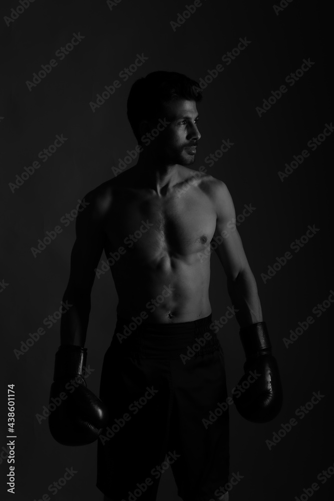 Black and white portrait of a boxer in shadows