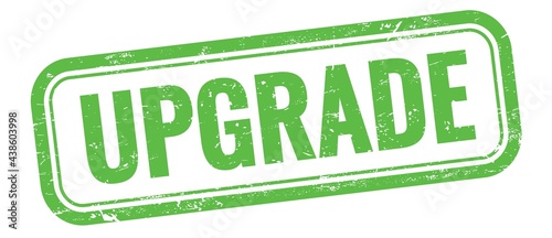 Foto UPGRADE text on green grungy vintage stamp.